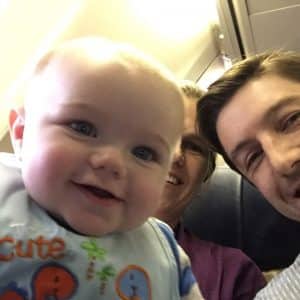 Family selfie during a plane ride when D was six months old.